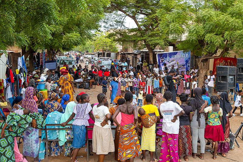 A large community gathering of women at a Kabakoo event in Bamako.
