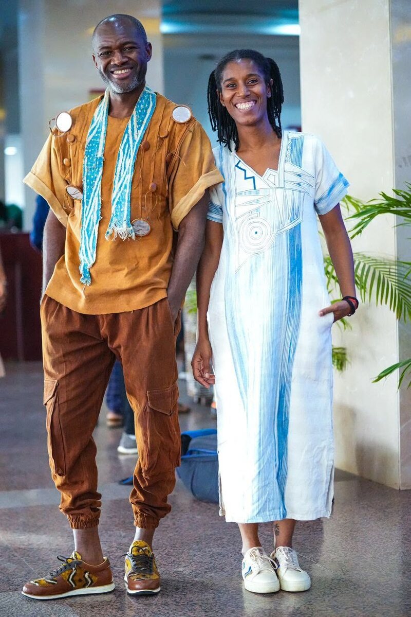 Michèle Traoré and Yanick Kemayou, smiling side by side, dressed by West African designers.